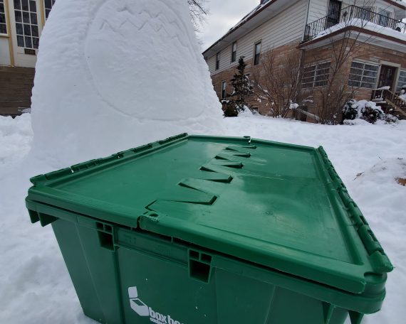 Green bin with snowman